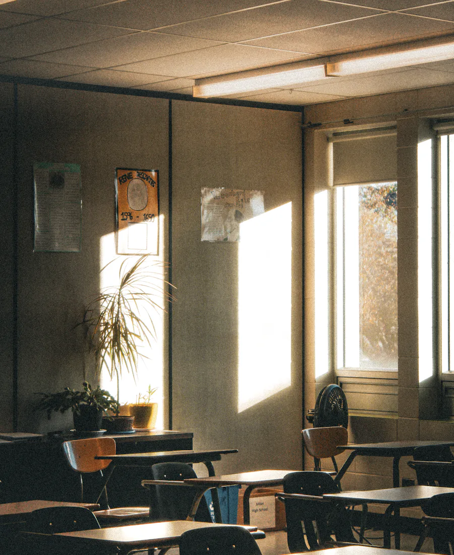 An empty classroom in late afternoon light.